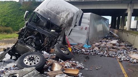 Semi-truck crash on I-5 exit ramp sends driver to hospital, spills ...