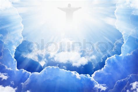 Jesus Christ in blue sky with clouds, ... | Stock image | Colourbox