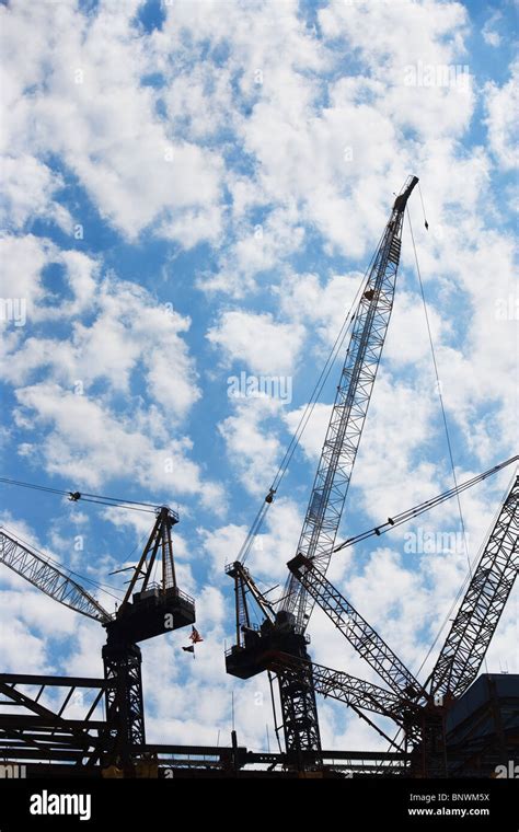 Cranes at construction site Stock Photo - Alamy