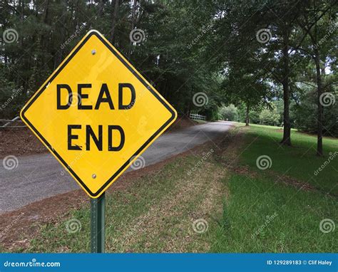 Dead End Sign With Dead End Road In Background Stock Image - Image of ...