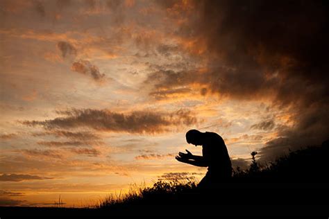 7,400+ Kneeling In Prayer Stock Photos, Pictures & Royalty-Free Images ...