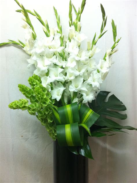 This beautiful arrangement by Belflora combines white gladioli ...