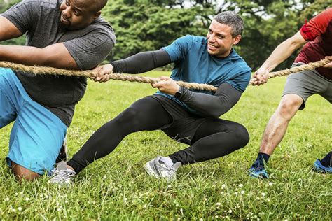 Team competing in tug of war | Premium Photo - rawpixel