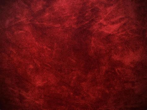 Dark red velvet fabric texture used as background. Empty dark red ...