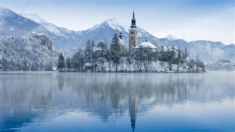 View of church on island on Lake Bled in winter, Slovenia | Windows ...