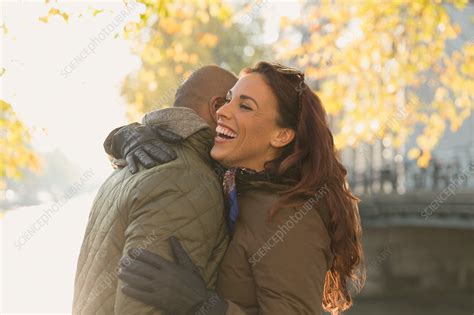 Happy couple hugging - Stock Image - F018/6341 - Science Photo Library