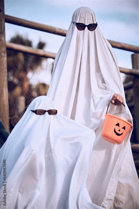 Halloween, friends and ghost costume for fun, festival and celebration ...