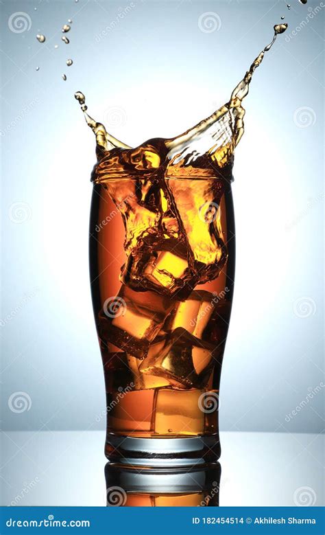 Splash From Ice Cubes In A Glass Of Cola, Isolated On The White ...