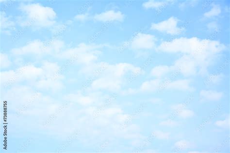 Light blue sky with clouds Stock Photo | Adobe Stock