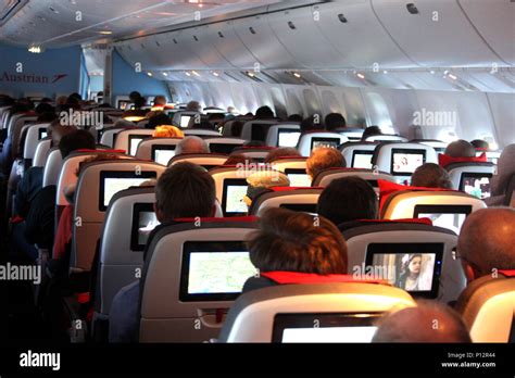 Interior of airplane during night flight Stock Photo - Alamy