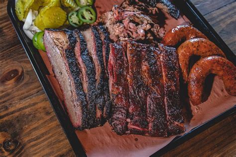 How Brisket, Sausage, and White Bread Came to Define Texas Barbecue