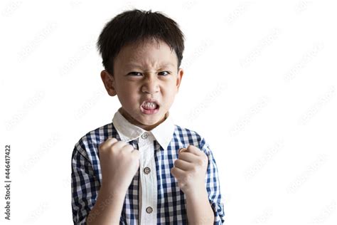 Angry little child clenched fist,show dissatisfied expression on face ...