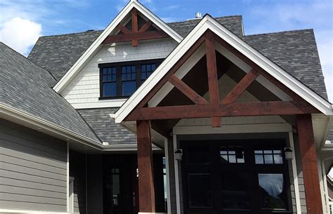 Timber frame trusses in open gable and front porch roof. #timber frame ...