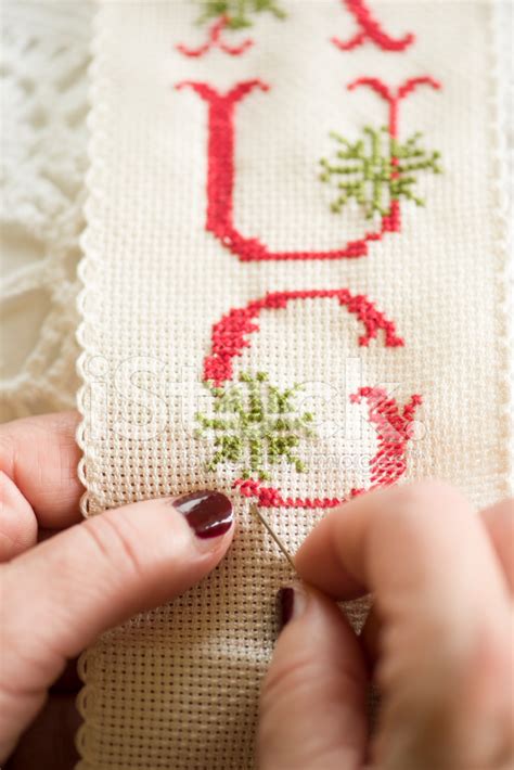 Cross Stitch With Hands Holding Needle And Thread Stock Photo | Royalty ...