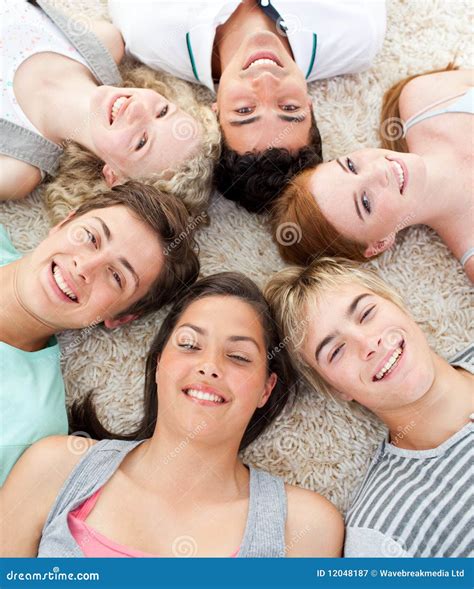 Teenagers with Their Heads Together Smiling Stock Image - Image of ...