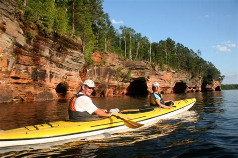 Sea kayaks are a great way to visit sea caves in the Apostle Island ...