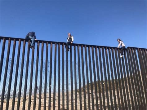 Mexican congressman climbs U.S. border fence to illustrate that Trump's ...