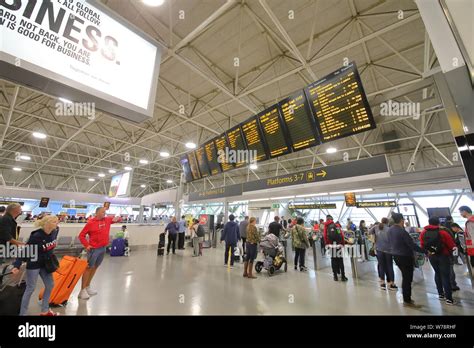 People travel at Gatwick airport train station London England Stock ...