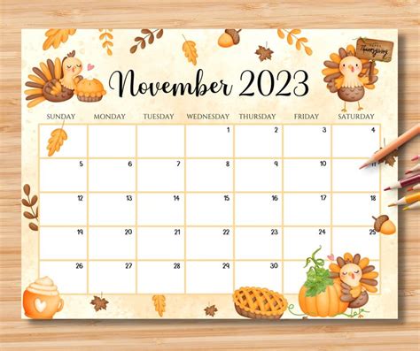 a calendar with autumn decorations and pencils next to it on a wooden ...