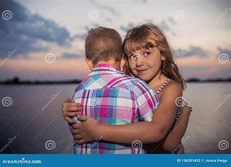 Little Boy and Girl Hugging, by the River Stock Photo - Image of nature ...