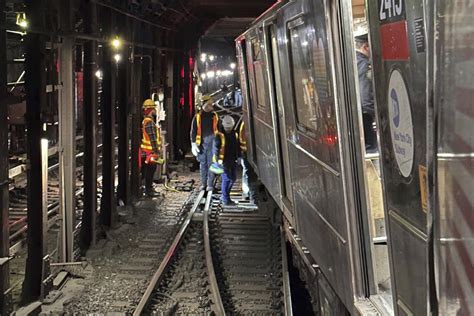 New York City subway train derails in collision with another train ...