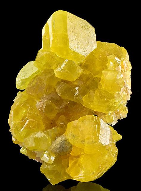 Sulfur (or sulphur) crystals with aragonite matrix. Yellow is the color ...