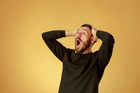 Portrait Of Young Man With Shocked Facial Expression Stock Photo ...