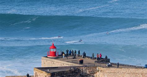 Nazare, Portugal - November 7, 2022 People watching the big giant waves ...