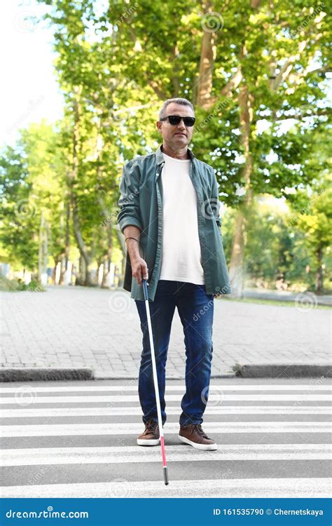 Mature Blind Person with White Cane Crossing Street Stock Photo - Image ...