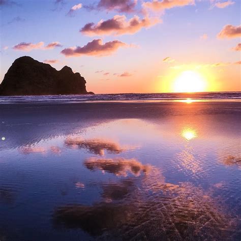 Epic sunset at Piha Beach, West Coast, Auckland, New Zealand. Photo by ...