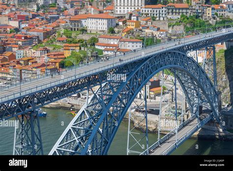 Porto Portugal bridge, people walk across the upper level of the Dom ...