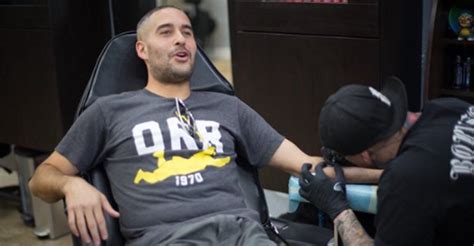 GIF | Jon Anik getting his '209' tattoo | BJPenn.com