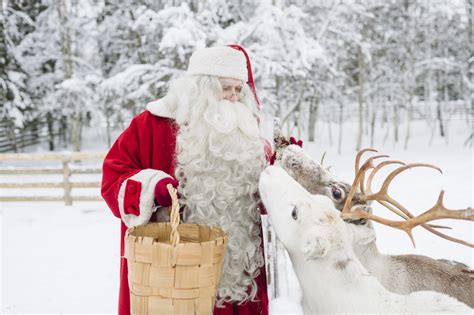 santa-claus-feeding-reindeer-rovaniemi-lapland-finland (6) - Lapland ...