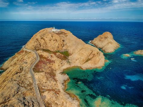 Premium Photo | Aerial view on a lighthouse located on a tiny peninsula