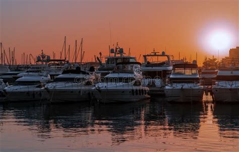 Marina with Boats and Yacht Under Sunset Editorial Stock Photo - Image ...