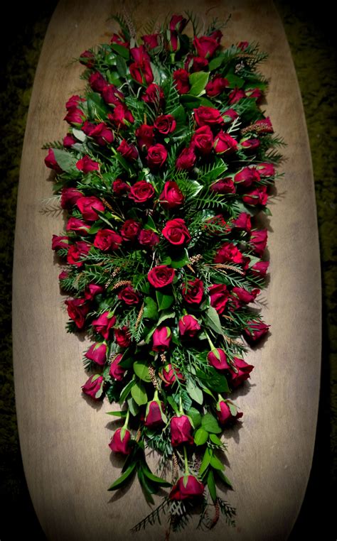 Gorgeous red rose funeral casket spray | Casket flowers, Funeral ...