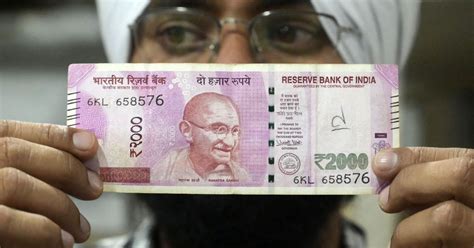 India's decision to withdraw 2,000-rupee notes from circulation draws ...