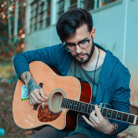 Photo of Man Playing Acoustic Guitar · Free Stock Photo