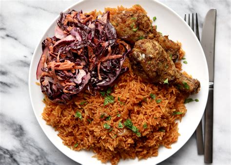 Jollof Rice and Chicken with Coleslaw - Travelandmunchies