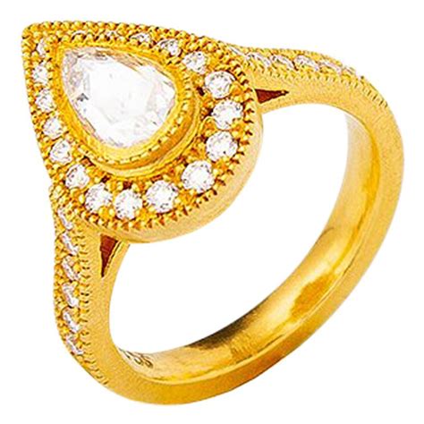 24 Karat Gold Handcrafted Tear Drop Form Rose Cut Diamond Solitaire ...