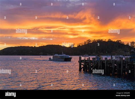 Oban, Stewart Island, Southland, New Zealand. Colourful sky reflected ...