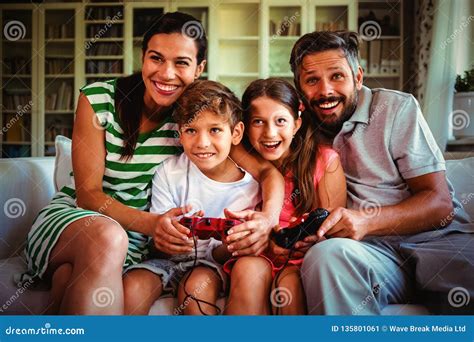 Parents Playing Video Games with Children Stock Image - Image of ...