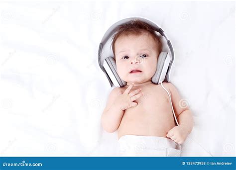 Cute baby with headphones stock photo. Image of childhood - 138473958