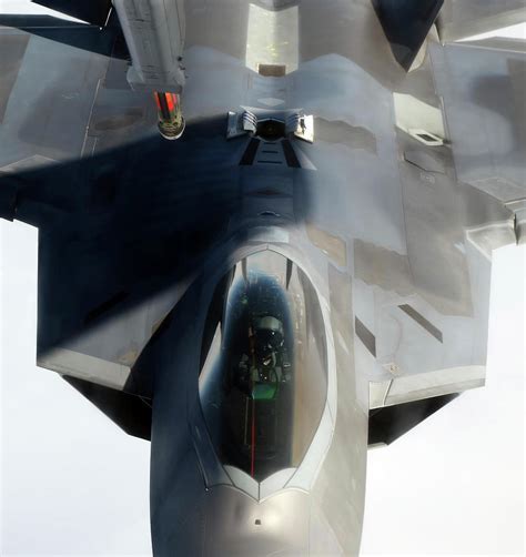 An F-22 Raptor Maneuvers Into Refueling Photograph by Stocktrek Images ...