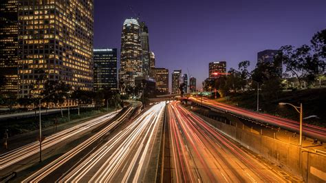 View of buildings with road during night time, highway 110, los angeles ...