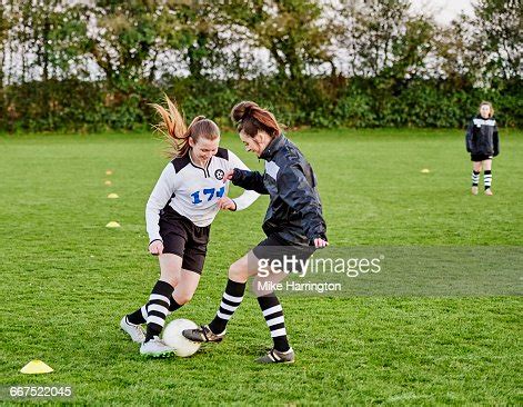 Two Female Footballers Practicing Skills High-Res Stock Photo - Getty ...