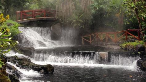 Costa Rica’s Tabacon hot spring resort at Arenal Volcano a waterfall ...