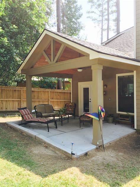 Gable roof patio cover with wood stained ceiling | Concrete patio ...