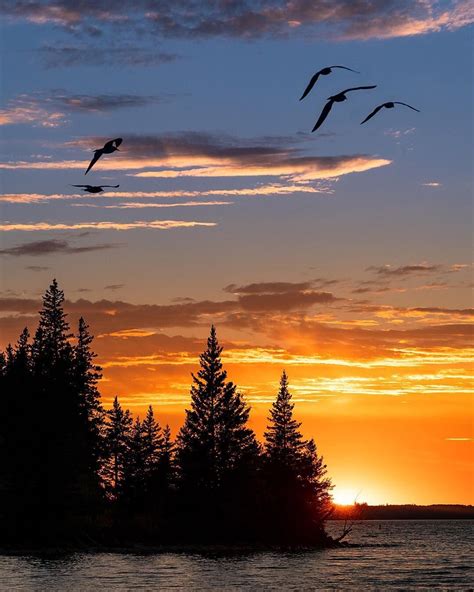 Sunset over Clear Lake in Riding Mountain National Park. One of the ...