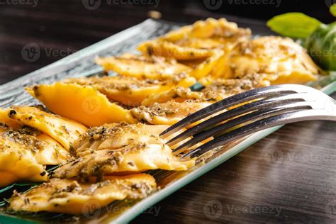 Italian stuffed pasta ravioli with pesto sauce 3956390 Stock Photo at ...